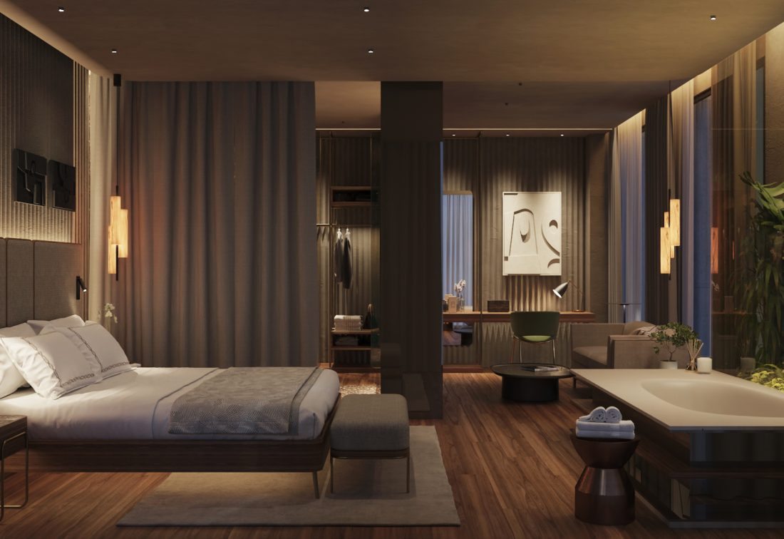 Suite de hotel contemporánea con cama grande y baño junto a jardín interior